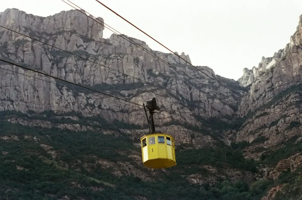 The yellow Aeri cable car climbing the mountain, one way to get from Barcelona to Montserrat